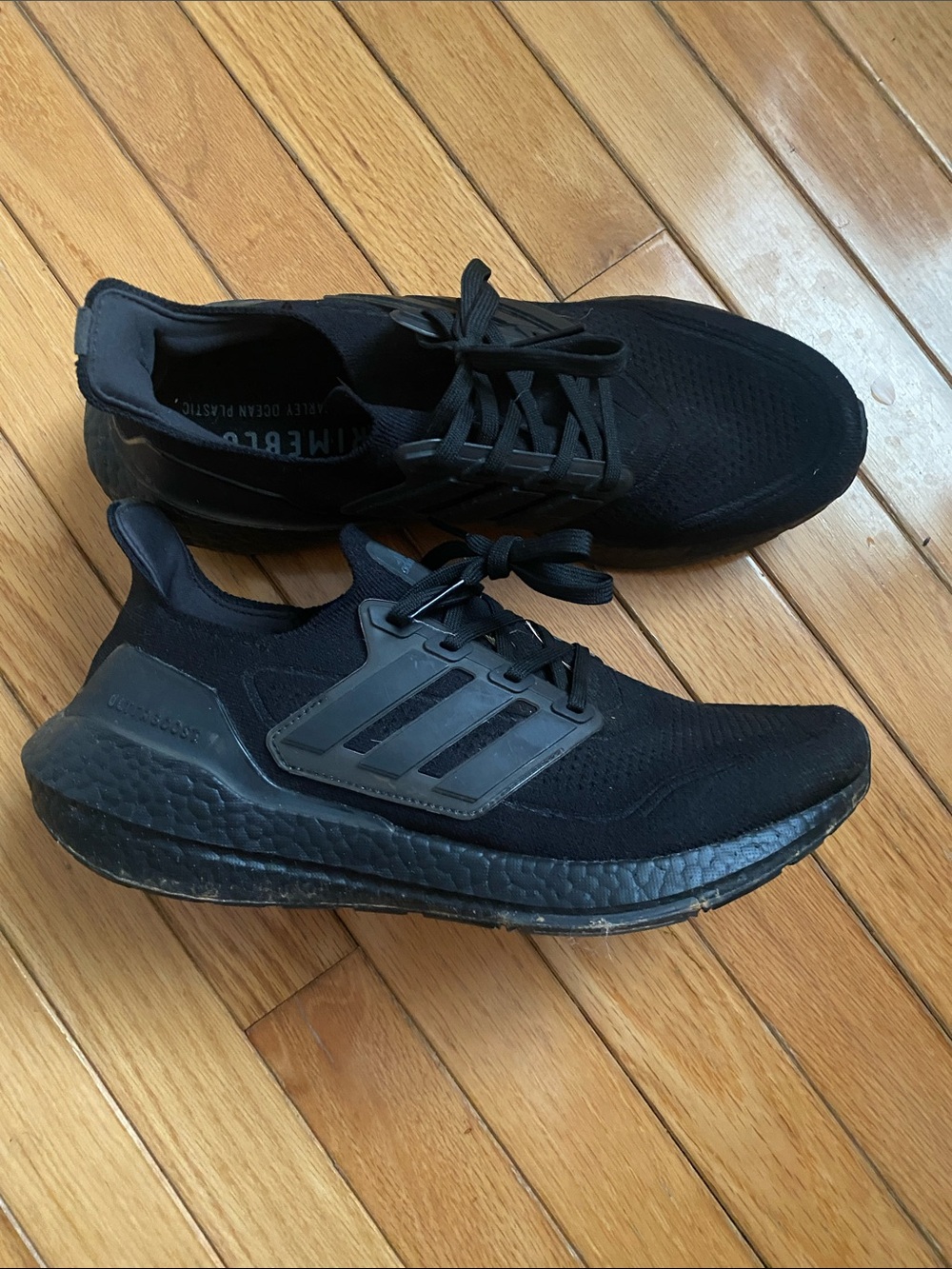 Adidas Ultraboost 21 sneakers in a "Triple Black